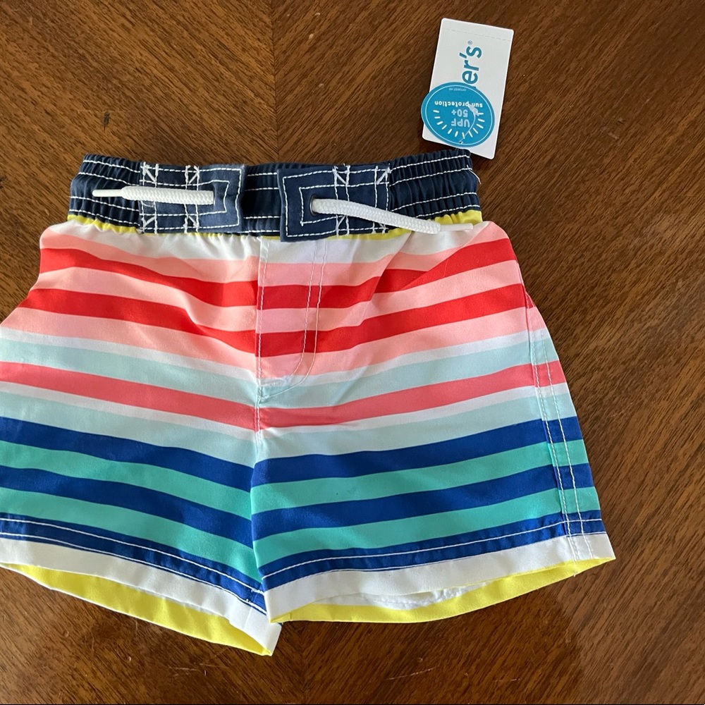 Carter’s swim trunks size 9 months NWT